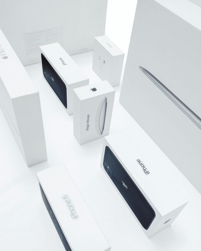 Aerial view of various Apple product boxes showcasing sleek design and branding.